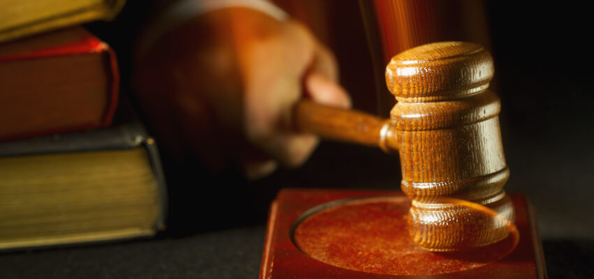 Builder fined for threatening clients